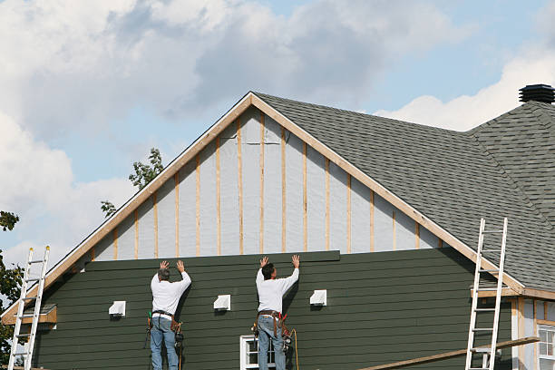 Professional Siding technician working in Enfield, NC